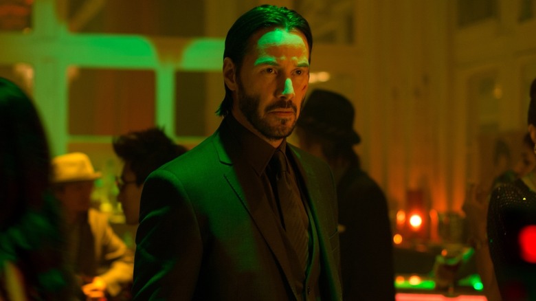 John Wick (Keanu Reeves) in a bar