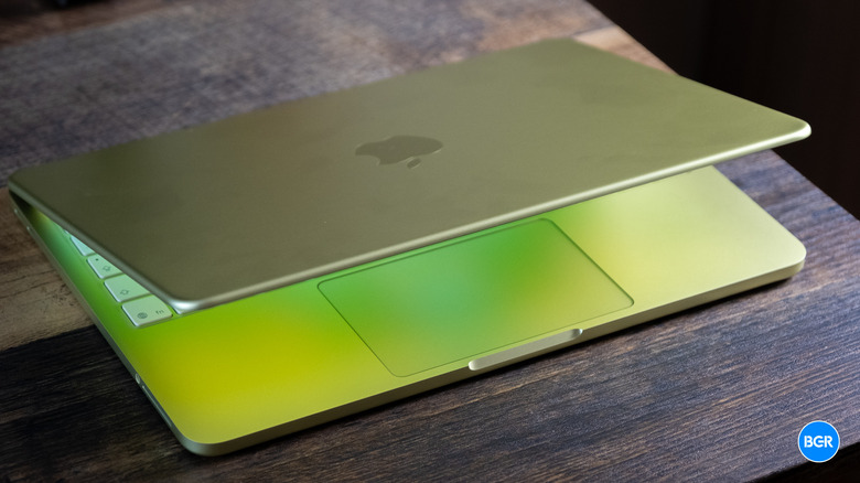 MacBook Neo on a table, with USB-C ports slightly visible on the left side.