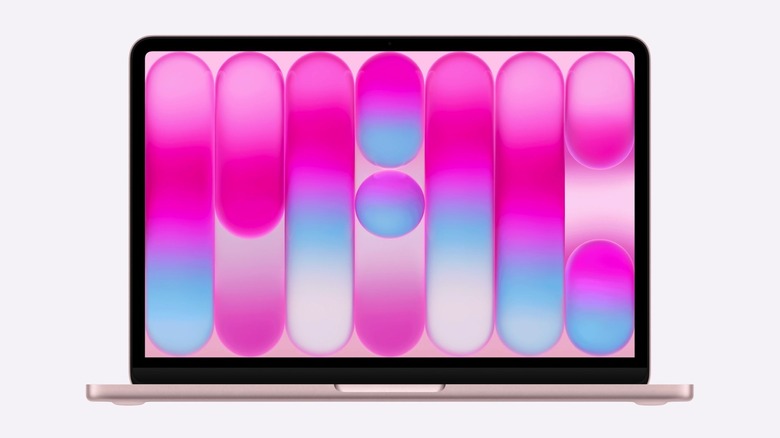 MacBook Neo in Citrus with a matching wallpaper that spells the word Mac.