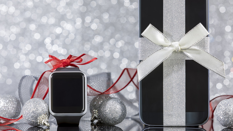 smartwatch and smartphone wrapped for Christmas.