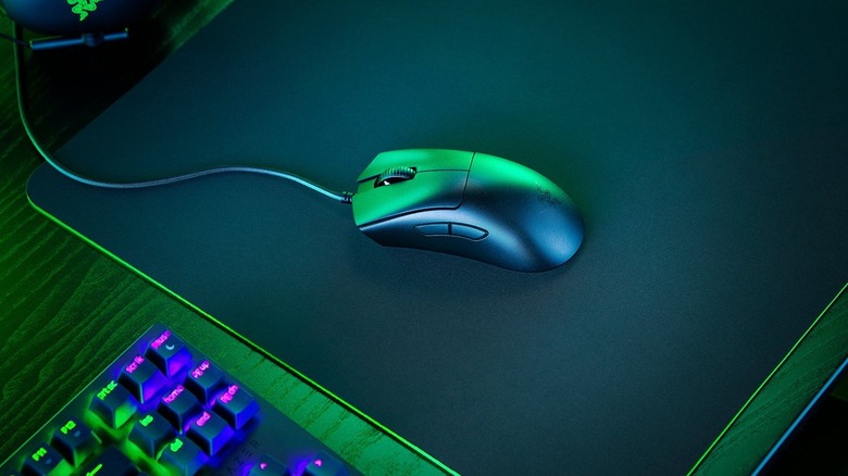 A wired Razer DeathAdder V3 gaming mouse on mousepad
