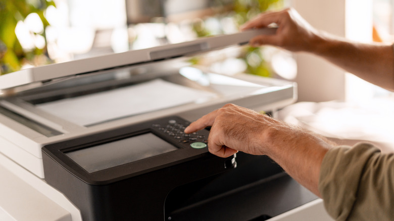 A man operating a printer