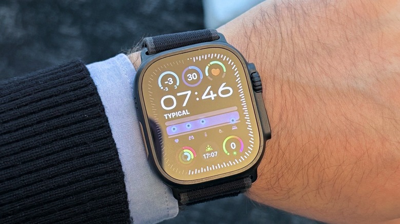 An Apple Watch Ultra on a man's wrist