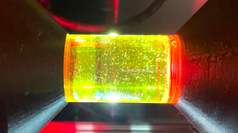 Computed Axial Lithography in action. A protector flashes resin with multiple 2D image to build a 3D print in seconds