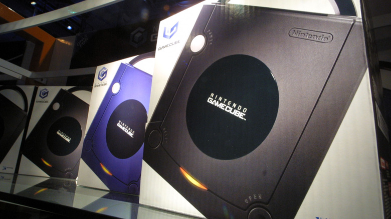 poster showing both a purple and a black Nintendo GameCube