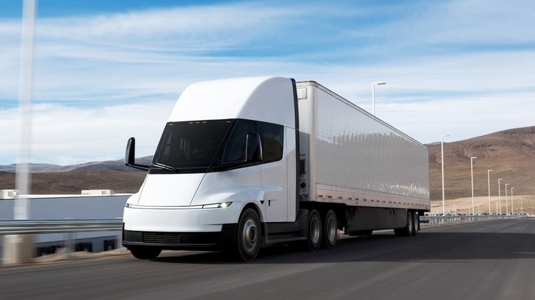 Tesla Semi on the road with blurry background to imply movement