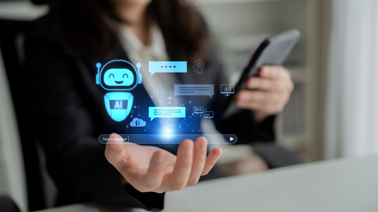 Virtual chatbot appearing in someone's hand