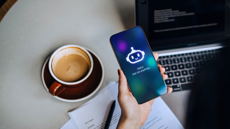 A person using an AI virtual assistant on a smartphone