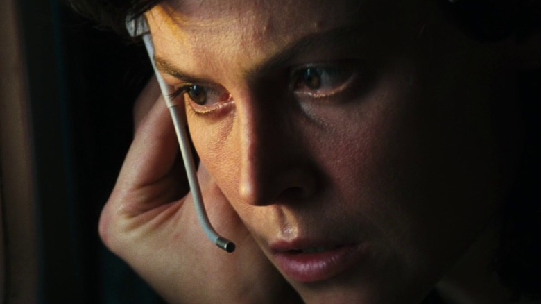 Ellen Ripley (Sigourney Weaver) speaking on a headset in Alien