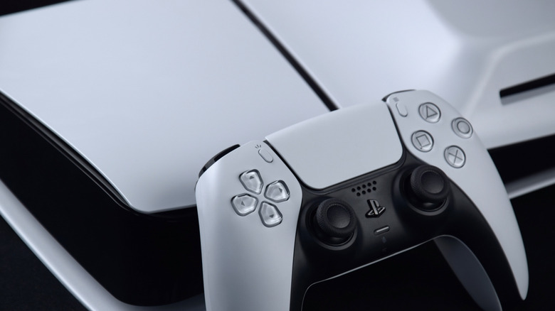 PlayStation 5 DualSense controller on top of a PS5