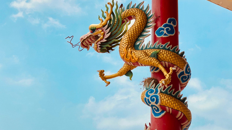 Chinese dragon statue wrapped around a column