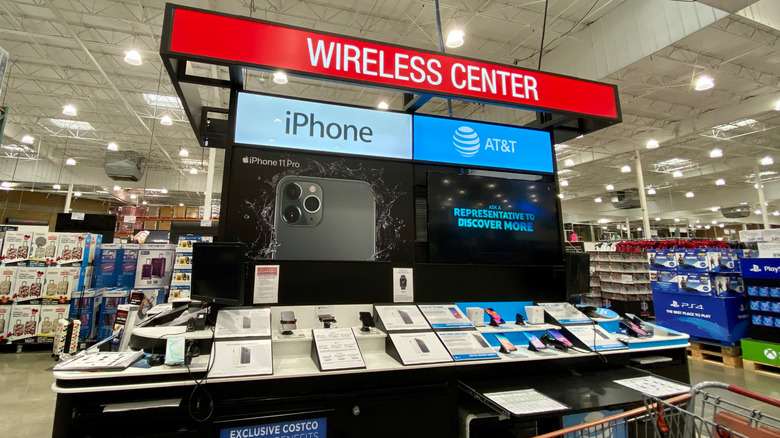 Costco Wireless Center kiosk with iPhones and other smartphones under AT&T