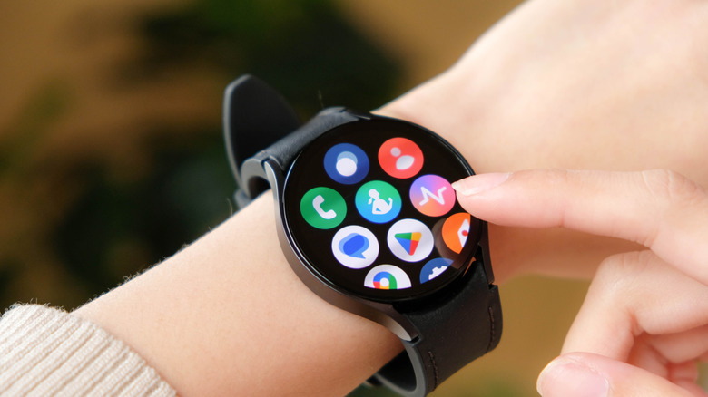 The apps of a Samsung Galaxy Watch on a person's wrist
