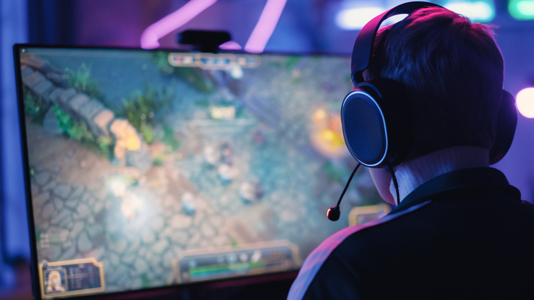 A person using an OLED monitor for gaming