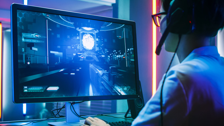 A gamer enjoys a high-quality image on an OLED monitor