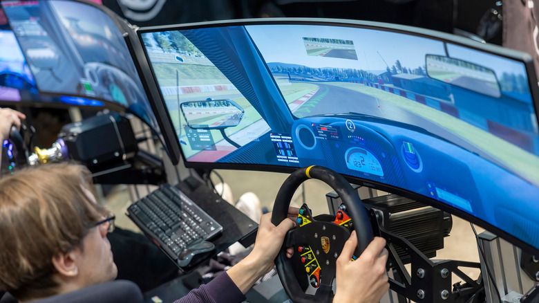 Playing a racing game on a curved monitor