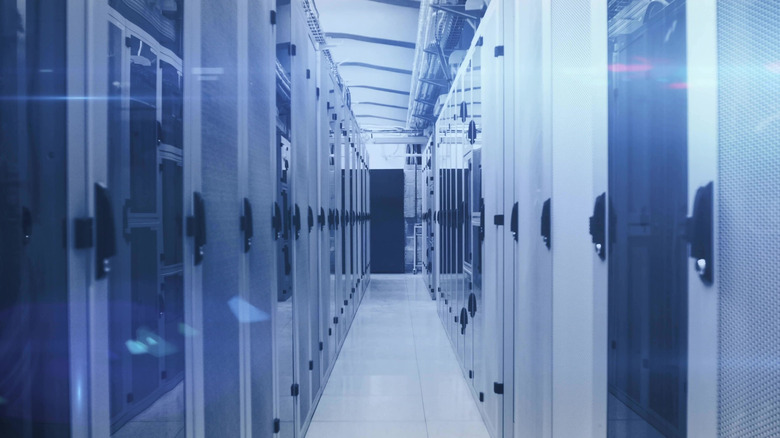 A hallway of server racks in a data center.