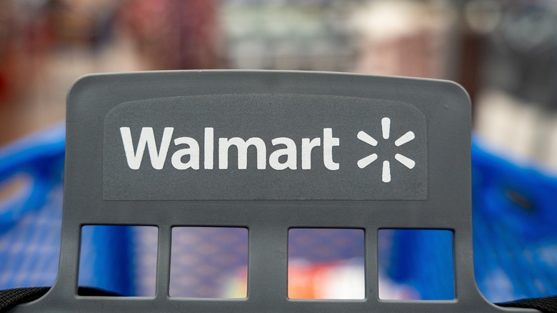 the Walmart logo on a cart in the store