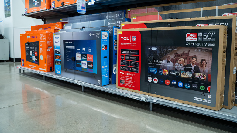TCL and Philips televisions on display in a retail store