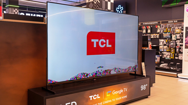 TCL 4K QLED TVs in their boxes.
