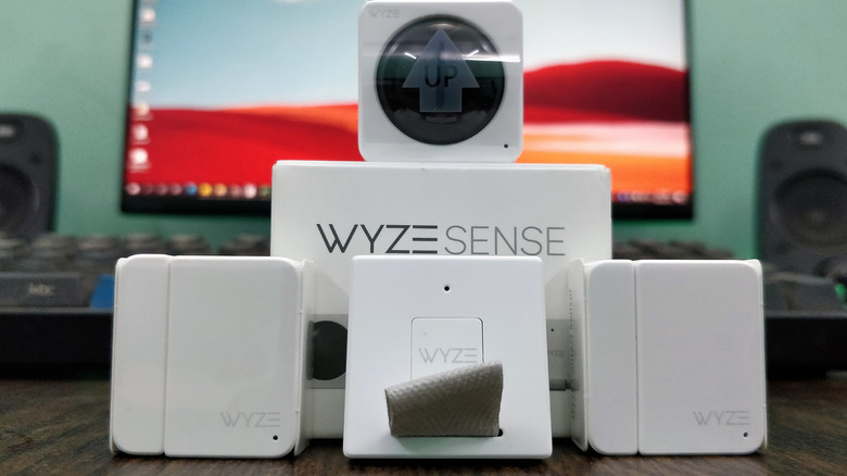Wyze sense smart motion detectors in front of a computer screen