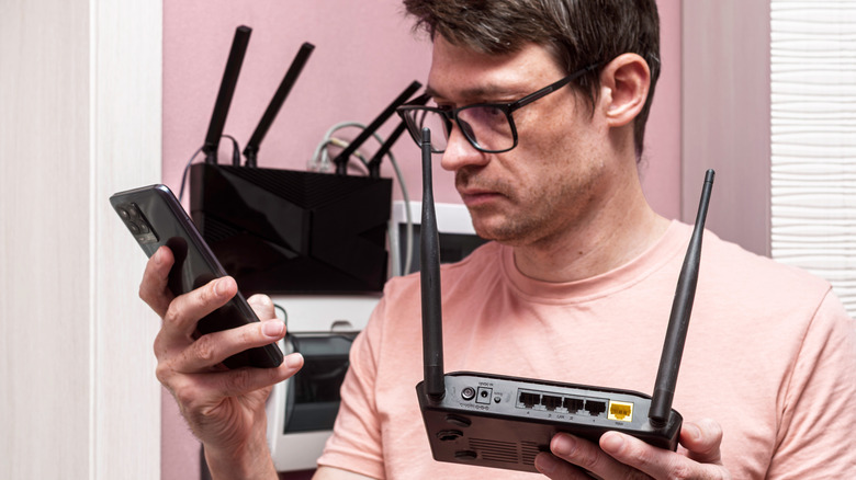 man troubleshooting router concept