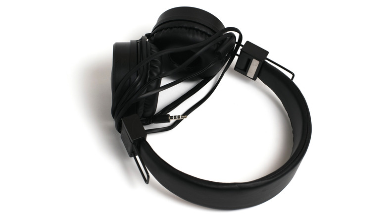 Black headphones on a white background