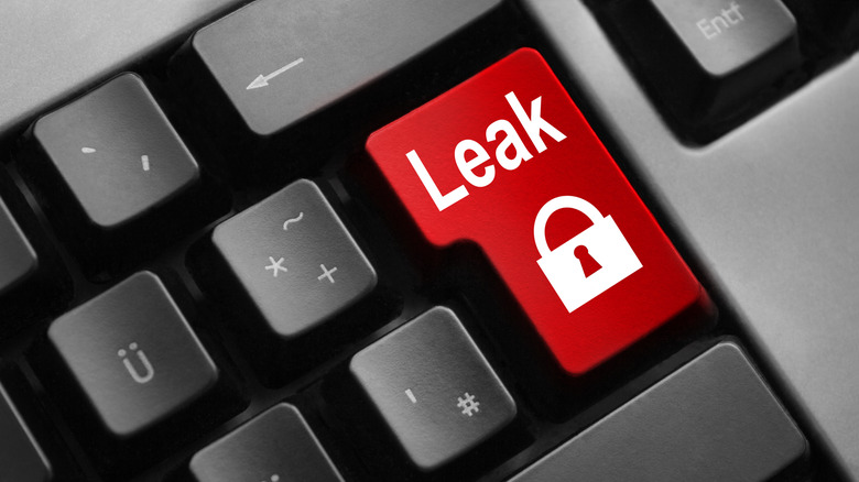 A dark grey keyboard with red enter button showing a lock symbol with leak written on it