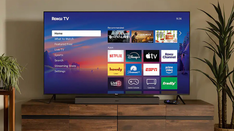 A Roku TV set up in a living room showing the menu screen.
