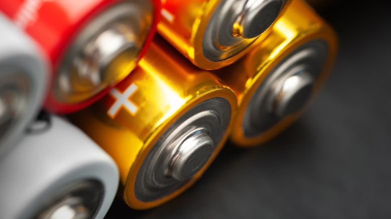 A close-up image of AA or AAA batteries stacked on top of each other.