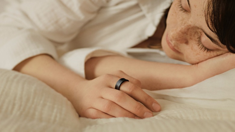 Woman sleeping while wearing a Samsung Galaxy Ring
