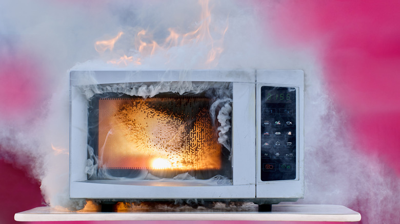 A microwave that has caught on fire