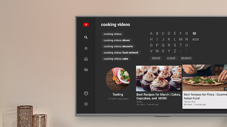YouTube search shown on a mounted TV.
