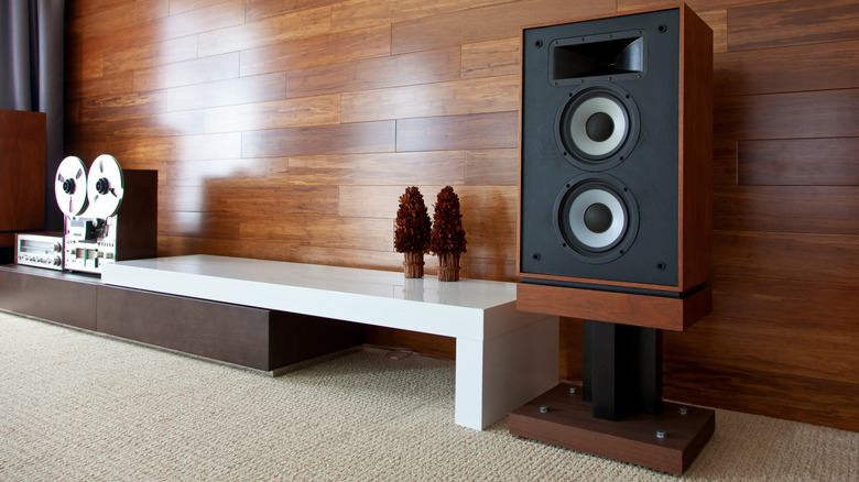A vintage audio system featuring a large speaker on a stand