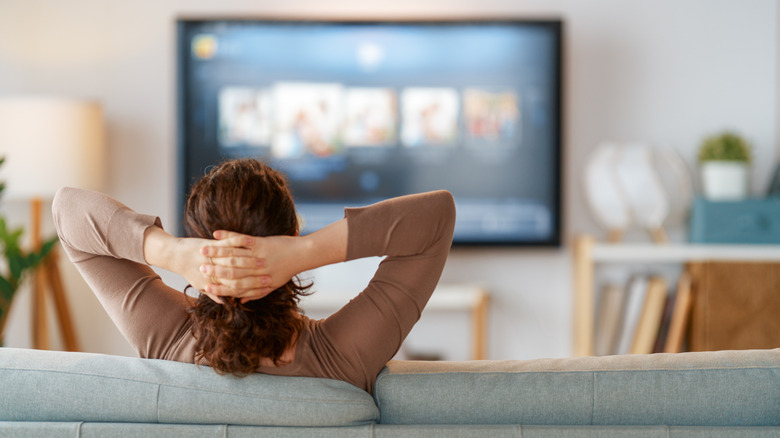 A person watching TV.