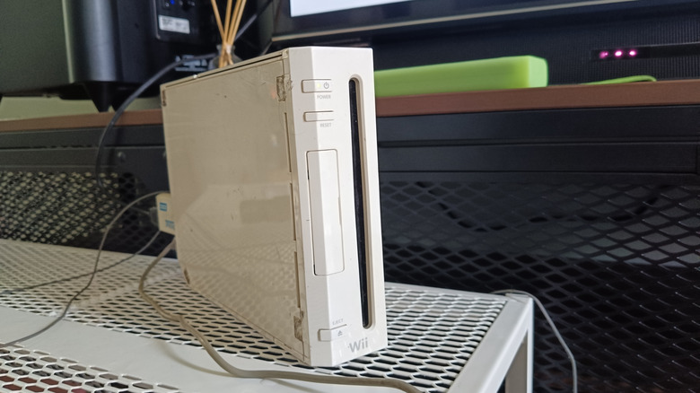 A Nintendo Wii on a grated surface