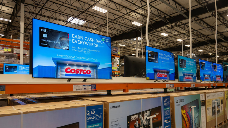 A row of TVs on display at Costco Wholesale.