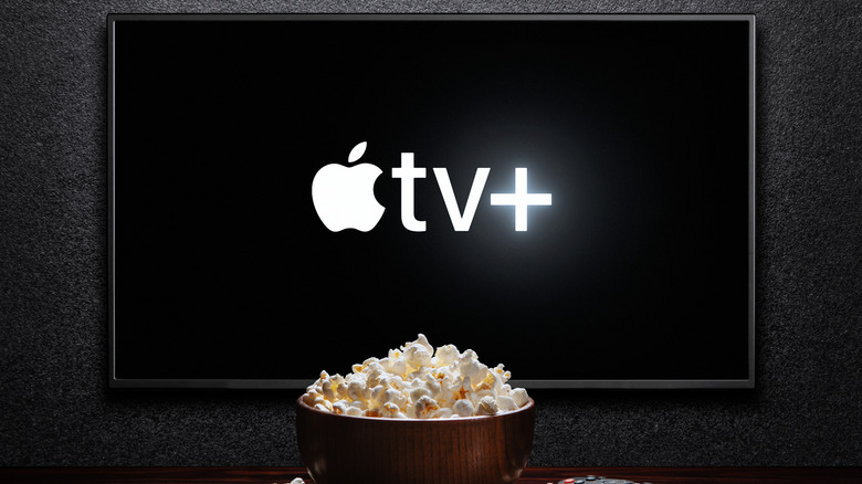 Apple TV+ logo on TV with a bowl of popcorn in front