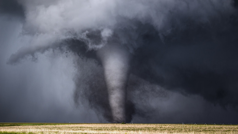 tornado traveling across the plains during a storm