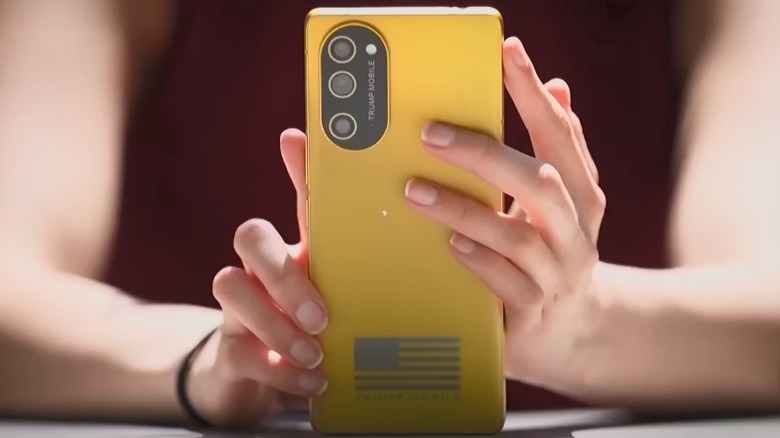 Person holding Trump Mobile T1 phone