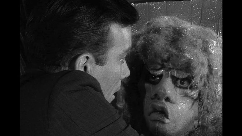 Robert Wilson (William Shatner) looking at a face outside of a plane window on "The Twilight Zone."