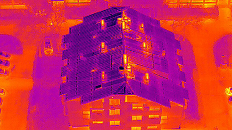 Building seen through thermal imaging camera attached to flying drone