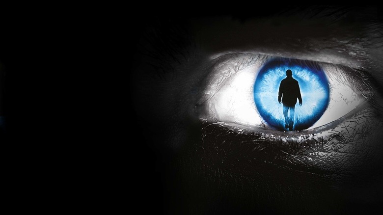 The Dead Zone promo image of a human iris with a silhouetted figure inside it.