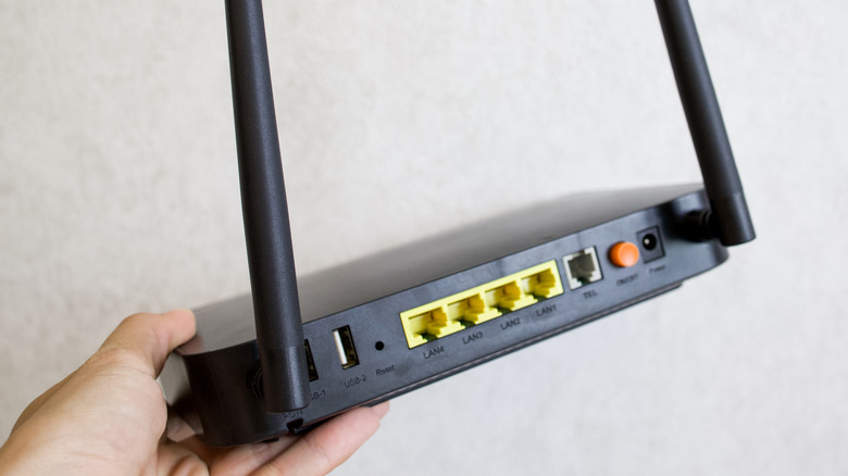 The connection ports on the back of a router