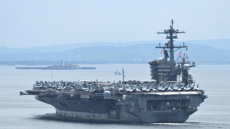 back and side of USS Abraham Lincoln as it sets off for the open seas