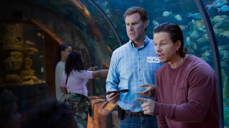 Will Ferrell and Mark Wahlberg at an aquarium during a scene in Daddy's Home.