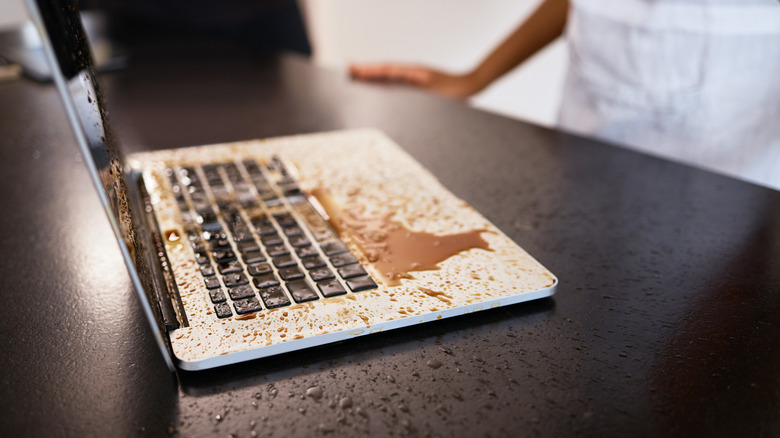 Laptop with coffee spilled all over it