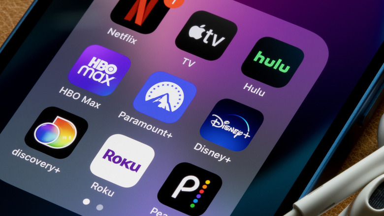 A picture of a phone screen showing various streaming apps, including HBO Max, Paramount+, Discovery+, and more
