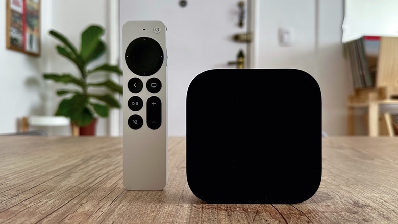 Close up shot of an Apple TV 4K with the Siri Remote on a table