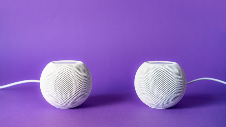 Two speakers on a purple background. Listen to music in stereo mode